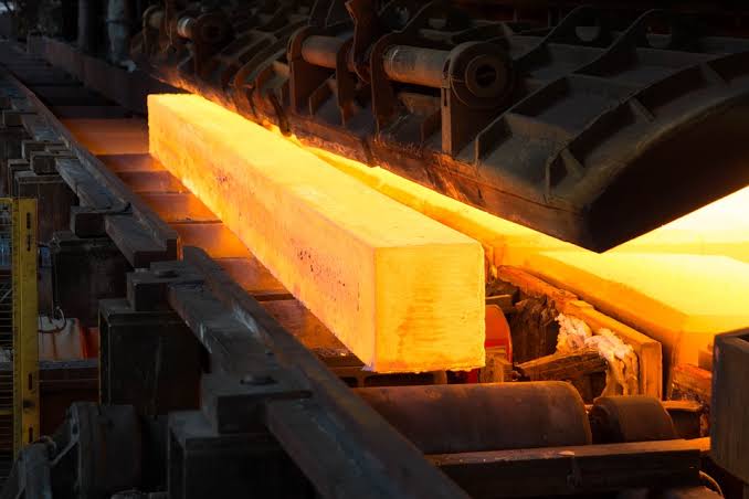 Glowing hot rolled steel billet on the rolling mill line